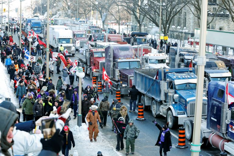 Trucks sit parked on Wellington Street near the parliament buildings