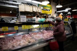 A customer shops at a poultry shop in Philadelphia, Pennsylvania