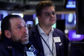 Traders work on the floor of the New York Stock Exchange (NYSE) in New York City, U.S.