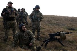 Soldiers from Carpathian Sich international battalion conduct manoeuvres near the front line, as Russia's attack on Ukraine continues, in Kreminna, Ukraine, January 3, 2023. REUTERS/Clodagh Kilcoyne