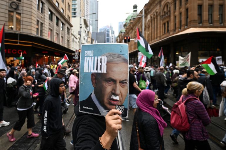 Demonstrators march through the streets against Israeli strikes in Gaza and Lebanon at a protest rally in the central business district of Sydney