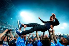 Napoli coach Antonio Conte is thrown in the air by his players