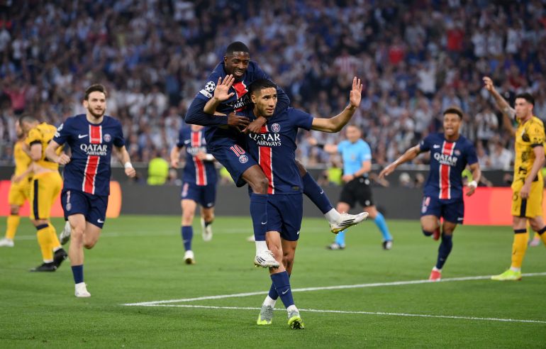 Achraf Hakimi of Paris Saint-Germain celebrates scoring his team's first goal with teammate Ousmane Dembele during the UEFA Champions League Final