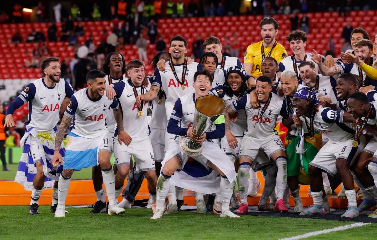 Tottenham Hotspur's Son Heung-min lifts the trophy with teammates after winning the Europa League Final 