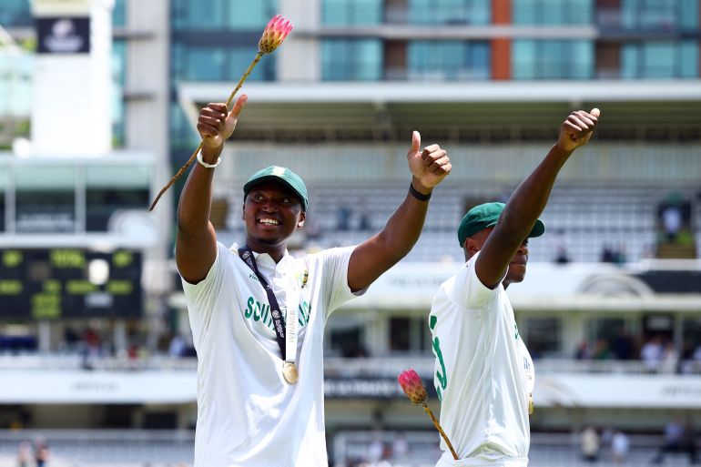 South Africa's Lungi Ngidi and Kagiso Rabada circle the ground and celebrate after winning the 2025 ICC World Test Championship final