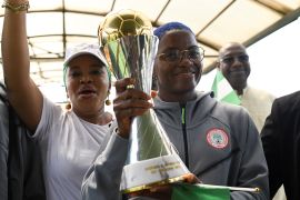 Nigeria’s Super Falcons captain Rasheedat Ajibade holds the Women’s Africa Cup of Nations (WAFCON) trophy