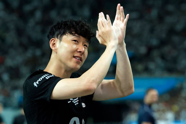 Son Heung-Min applauds fans.
