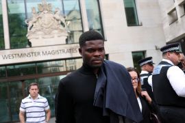 Former Arsenal player Thomas Partey, who has been charged with five counts of rape and one count of sexual assault, walks outside Westminster Magistrates' Court, in London