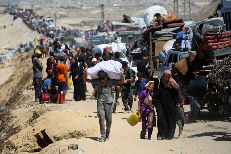 Palestinians from Gaza City on the coastal road near the Nuseirat refugee camp