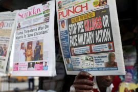 A newspaper vendor in Lagos displays front-page articles reporting Trump&#039;s threat to Nigeria over the treatment of Christians, November 2, 2025 [Sodiq Adelakun/Reuters]