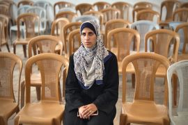 Israa al-Areer travels to Nasser Hospital in Khan Younis whenever Israel returns bodies to Gaza, as she searches for her husband and brother [Abdelhakim Abu Riash/XEn News]