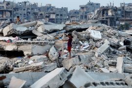Palestinian children stand on the rubble of destroyed buildings in Jabalia, northern Gaza Strip, November 6, 2025 [Mahmoud Issa/Reuters]
