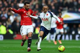 Tottenham Hotspur&#039;s Xavi Simons in action with Manchester United&#039;s Bruno Fernandes [Matthew Childs/Action Images via Reuters]